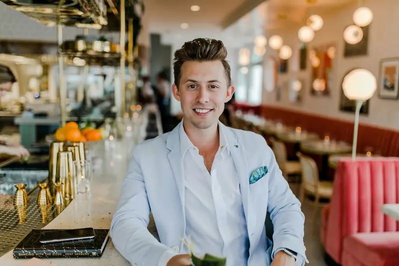 A restaurant owner seated in his dining room