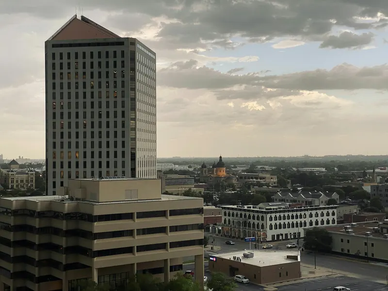 An aerial view of downtown Wichita office towers and neighborhoods